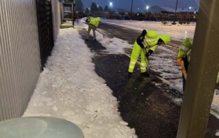 Sweep-Rite – people shoveling snow in the dark